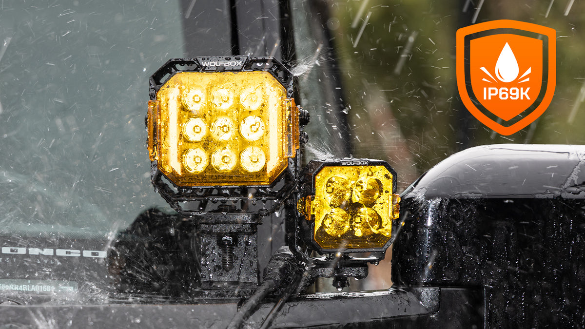 Wolfbox NomadRover 3" off-road LED pods (40W, 4890 LM) on Ford Bronco, with specs.